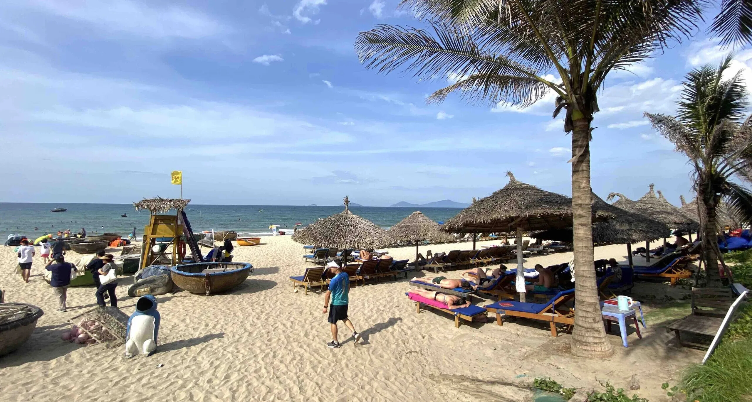 Beaches in Hoi An 8 Tourists sun bathing in Cam An beach