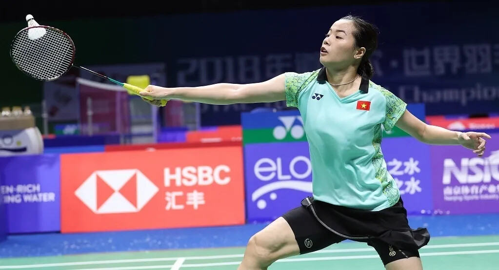 A woman badminton player in action